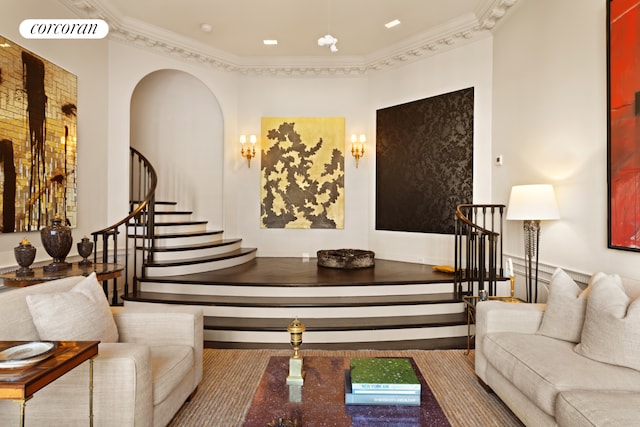 interior space featuring stairs, arched walkways, visible vents, and crown molding