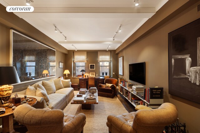 living room featuring visible vents and track lighting