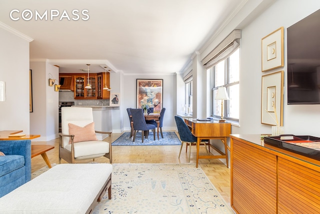 132 E 35th St Unit 7H, New York City, NY 10016 - living room with ornamental molding and baseboards