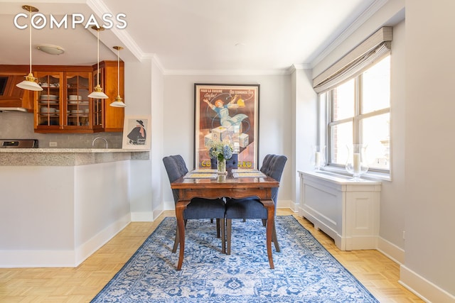 132 E 35th St Unit 7H, New York City, NY 10016 - dining space with baseboards and crown molding