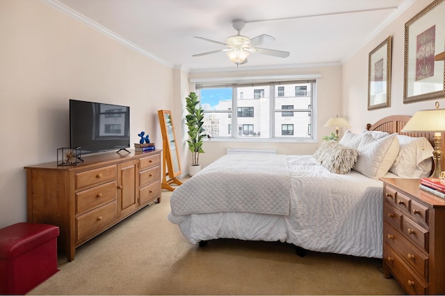 bedroom featuring ceiling fan, ornamental molding, and light colored carpet