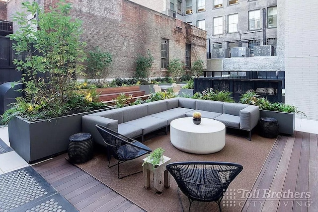 wooden terrace featuring an outdoor living space