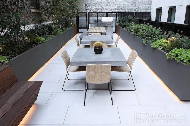 view of patio featuring area for grilling and outdoor dining space