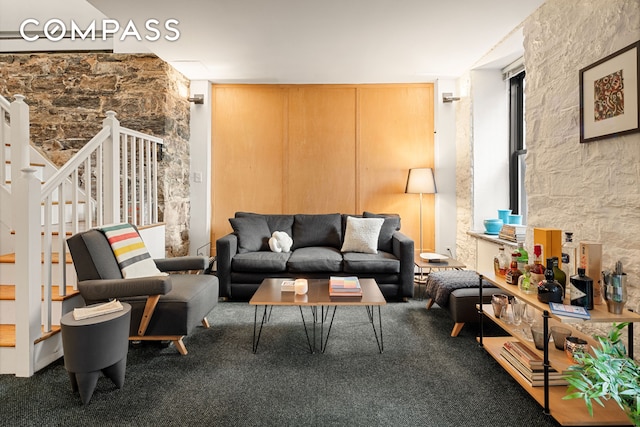 carpeted living room with stairway