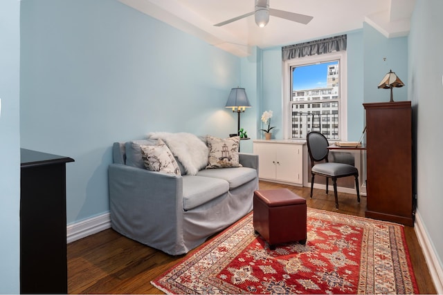 interior space with ceiling fan, wood finished floors, and baseboards