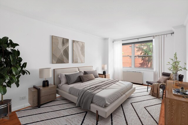 400 E 77th St Unit 3-A, New York City, NY 10075 - bedroom featuring ornamental molding and wood finished floors