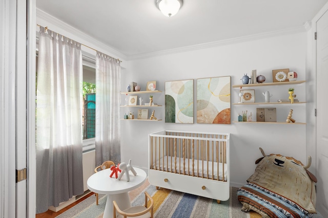 400 E 77th St Unit 3-A, New York City, NY 10075 - bedroom with ornamental molding and a nursery area