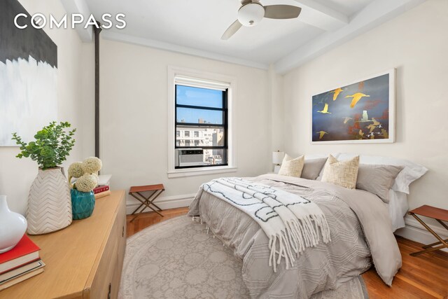 bedroom with ceiling fan and wood finished floors