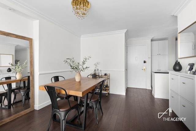 dining room featuring a chandelier, baseboards, crown molding, and dark wood-type flooring