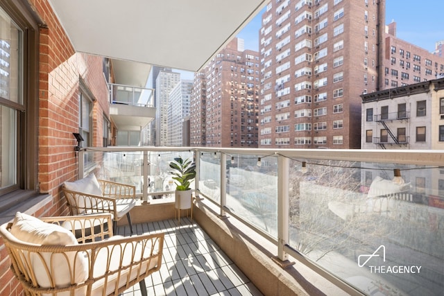 balcony with a sunroom and a city view