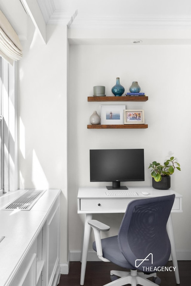 office space featuring wood finished floors, baseboards, and ornamental molding