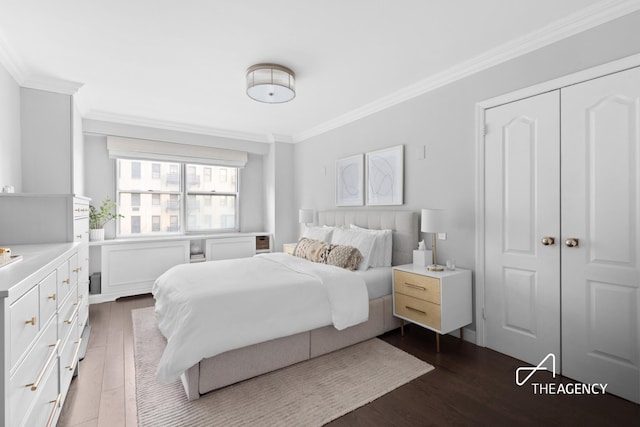 bedroom featuring dark wood-style floors and crown molding