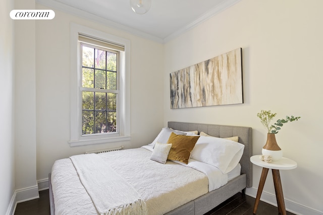 344 W 12th St Unit 3C, New York City, NY 10014 - bedroom featuring ornamental molding, baseboards, and dark wood-style flooring