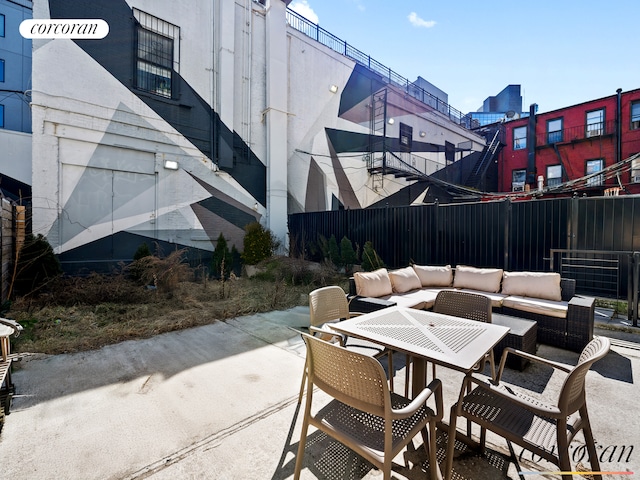 view of patio / terrace with fence and an outdoor hangout area