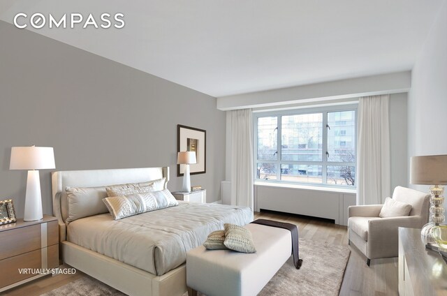 bedroom featuring light wood-style floors