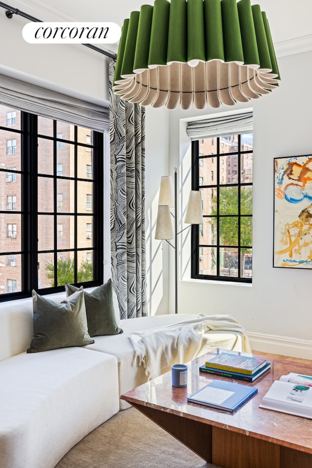 interior space featuring a wealth of natural light and crown molding