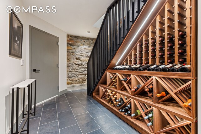 wine cellar with dark tile patterned flooring