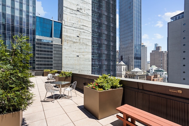 view of patio / terrace featuring a city view