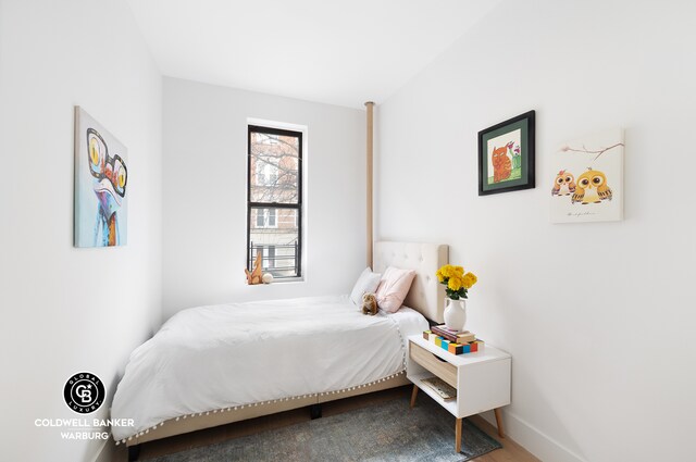 bedroom featuring baseboards