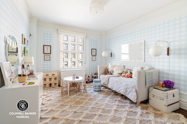 bedroom featuring ornamental molding and wallpapered walls