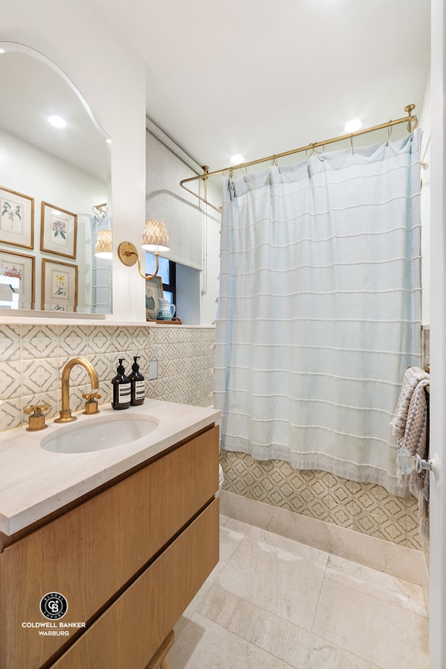 bathroom with decorative backsplash, tile patterned flooring, vanity, and a shower with shower curtain