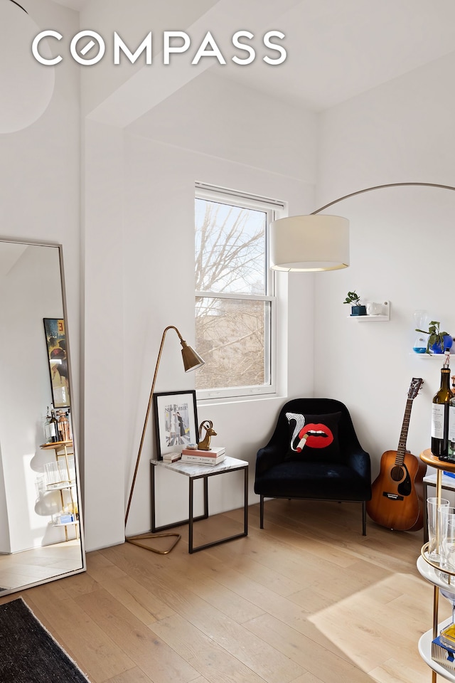 sitting room with light wood-style flooring