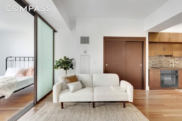 150 Myrtle Ave Unit 602, New York City, NY 11201 - living room featuring light wood-type flooring