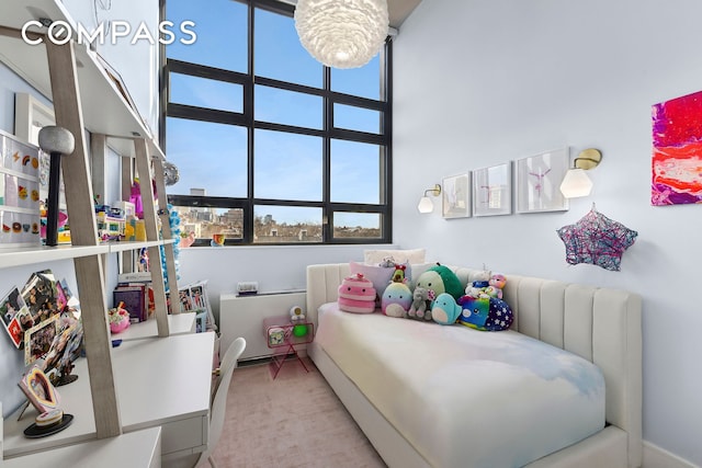 bedroom featuring a towering ceiling