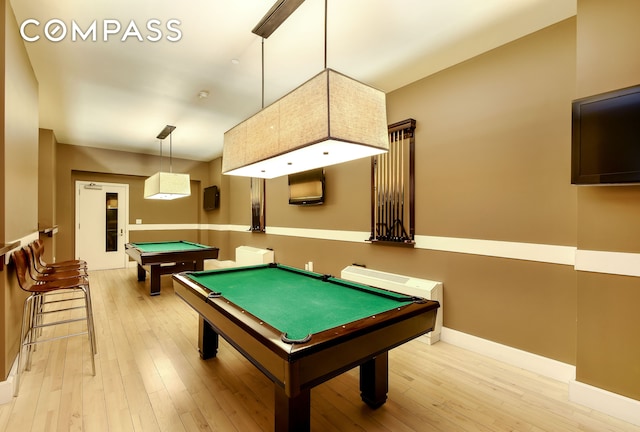 playroom featuring light wood-type flooring, pool table, and baseboards