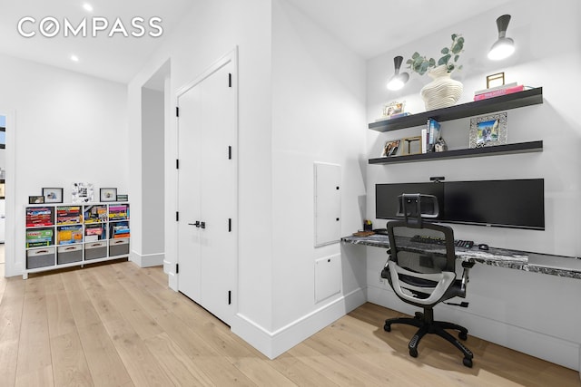 home office with recessed lighting and light wood-style flooring