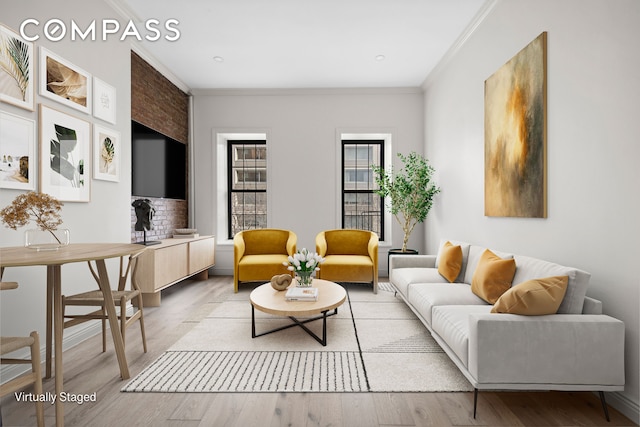 living room with ornamental molding and light wood-style floors