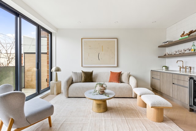 96 Coffey St, New York City, NY 11231 - living area with wet bar, light wood-style floors, beverage cooler, and recessed lighting