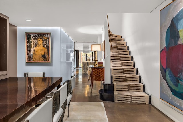 interior space with concrete flooring and recessed lighting