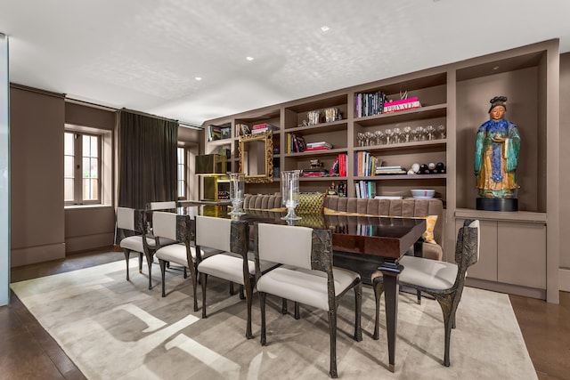 sitting room featuring built in shelves and recessed lighting