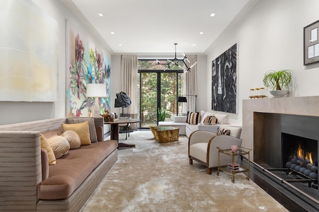 interior space with a chandelier, carpet flooring, and a premium fireplace