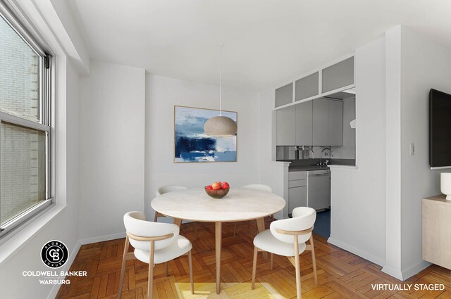 dining area with a healthy amount of sunlight and baseboards