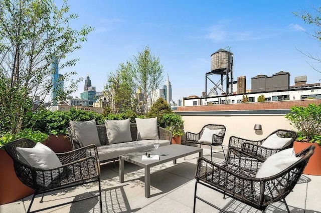 view of patio / terrace featuring outdoor lounge area and a view of city