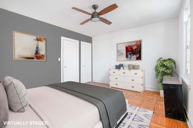 bedroom with baseboards and a ceiling fan