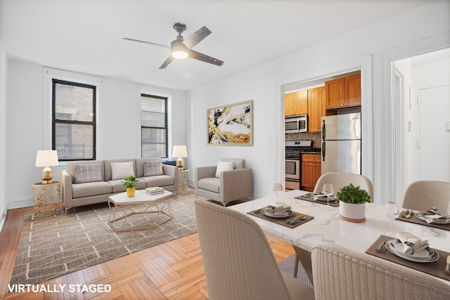 living area with a ceiling fan