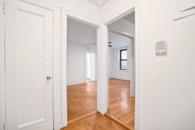 corridor featuring baseboards