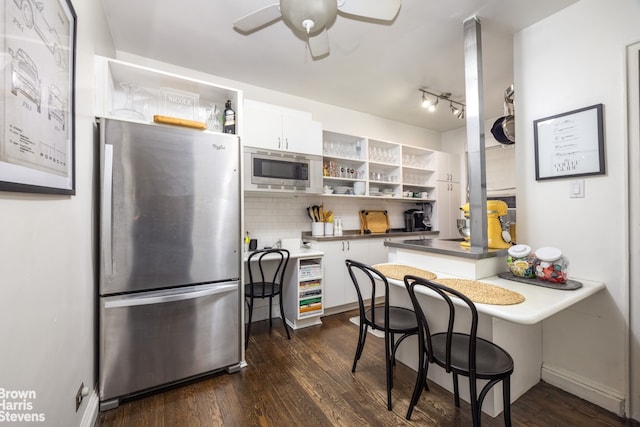 kitchen with open shelves, tasteful backsplash, white cabinetry, and stainless steel appliances