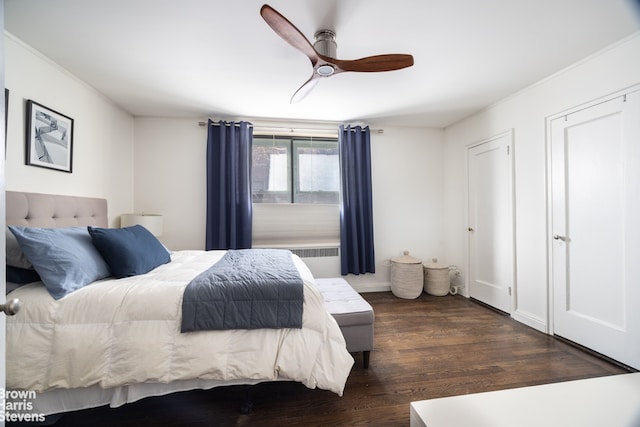 bedroom with a ceiling fan and dark wood-type flooring