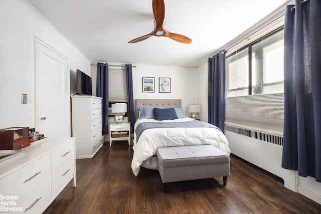 bedroom with a ceiling fan and wood finished floors