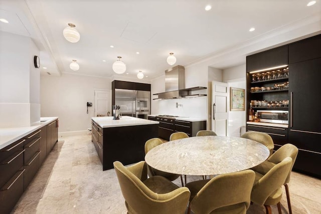 dining space with ornamental molding, recessed lighting, and baseboards