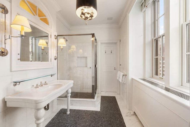 full bath featuring crown molding, a stall shower, and marble finish floors