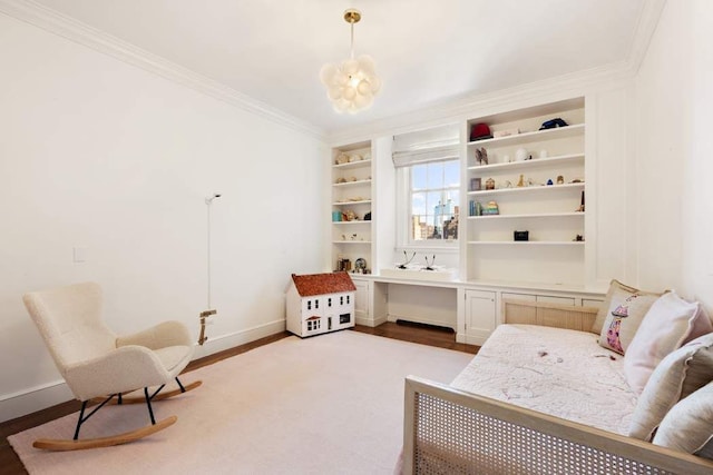 living area featuring crown molding, wood finished floors, baseboards, a chandelier, and built in features