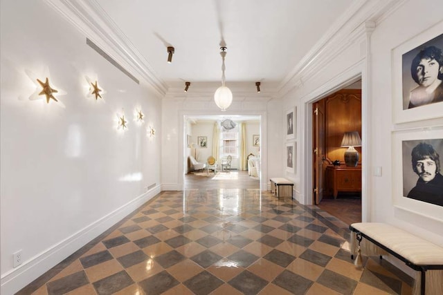 hall featuring ornamental molding and baseboards