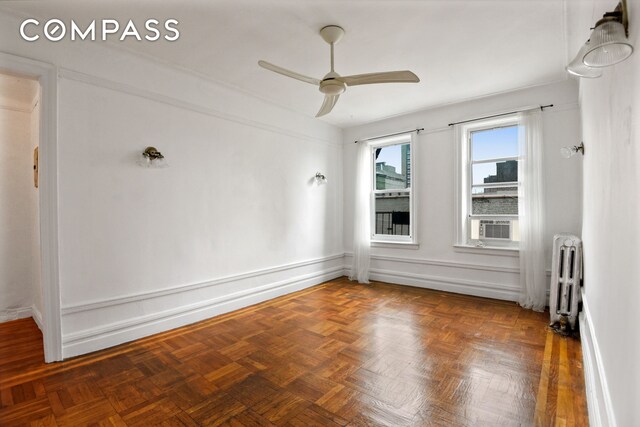 720 W 173rd St Unit 59, New York City, NY 10032 - spare room with radiator and a ceiling fan