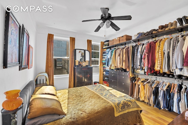 bedroom with wood finished floors and a ceiling fan