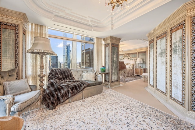 living area featuring a view of city, ornamental molding, a raised ceiling, and a chandelier